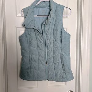 North face women’s puffer vest in size large a beautiful light blue,close to new